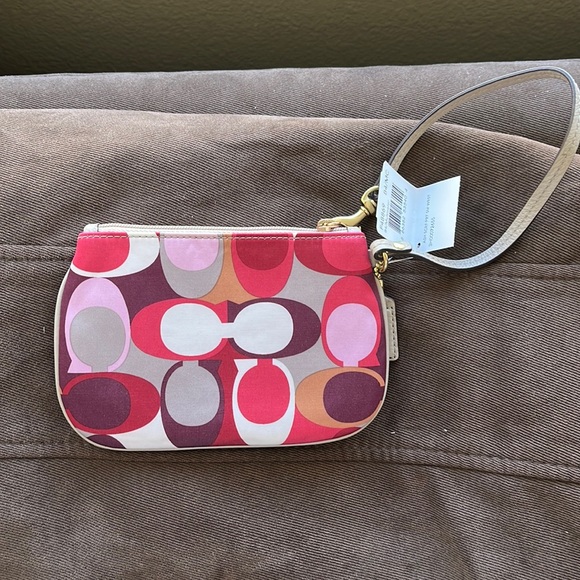 Coach Handbags - NWT Coach wristlet multicolored in excellent condition. Great gift idea!